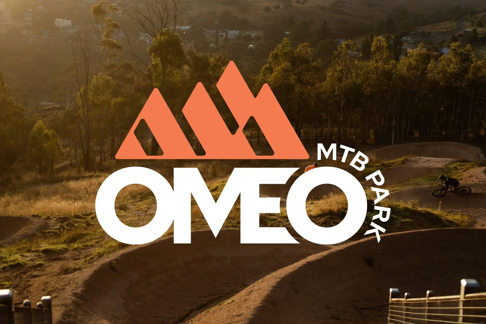 Omeo Logo Reverse 2 col on photo